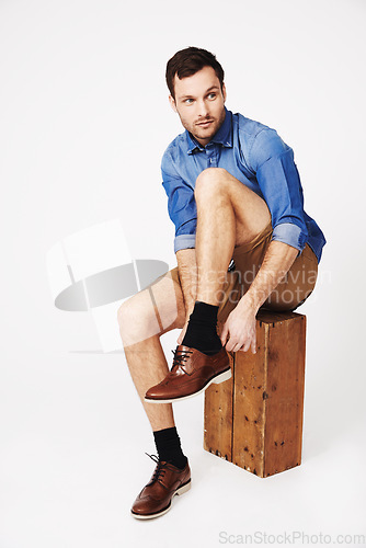 Image of Fashion, man and shoes in studio against white background for morning routine or dressing. Shoe, choice and casual male with outfit for style, decision and fashionable or trendy clothing aesthetic