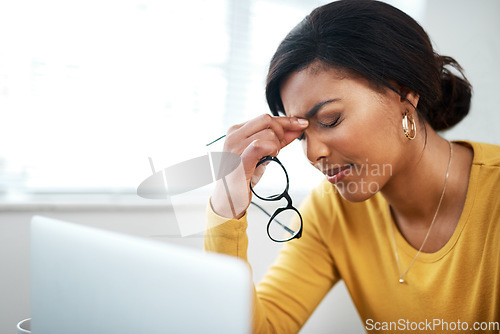 Image of Business woman, stress and headache on laptop with pain, mental health problem and burnout or anxiety risk. Depressed, tired and fatigue person with glasses, migraine and sad, frustrated on computer