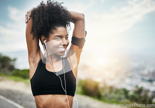 Image of Smile, woman and stretching arms for running outdoors with music for fitness, workout or cardio routine. Stretch, exercise and happy African female runner in nature with podcast for training run