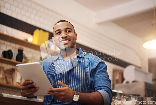 Image of Happy, tablet and waiter with man in cafe for online, entrepreneurship and startup. African, technology and food industry with small business owner in restaurant for barista, network and coffee shop