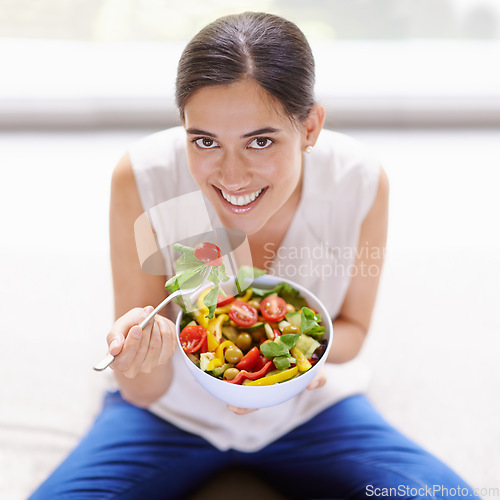 Image of Happy woman, portrait smile and eating salad for healthy diet, food or nutrition at home. Female with bowl, fork or vegetables smiling for natural health, greens and wellness for dieting in happiness