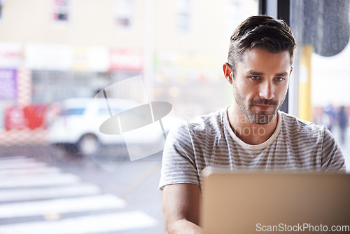 Image of Entrepreneur, laptop or man in cafe reading news online the stock market for trading report update. Coffee shop, remote work or trader typing an email or networking on internet or digital website