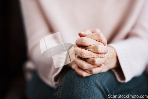 Image of Woman, hands together and closeup with stress and anxiety in therapy for psychology crisis. Pray, mental health and problem with hand of a female patient scared with depression at counselling on sofa