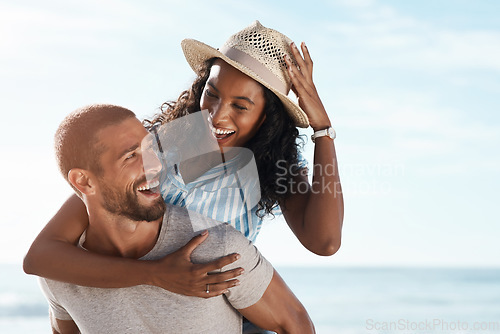 Image of Love, beach and piggy back, happy couple with blue sky on romantic summer holiday travel to ocean. Romance, man and woman have fun at sea, happiness on honeymoon and vacation time together in Mexico.