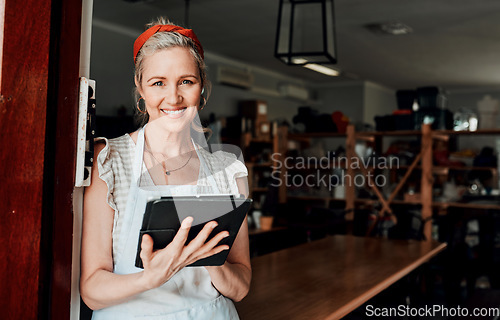 Image of Happy woman, portrait smile and tablet in small business confidence at entrance for workshop in retail store. Confident female person, ceramic designer or owner with technology for creative startup