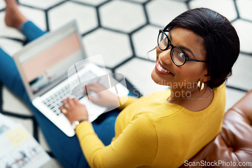 Image of Planning, portrait and woman on laptop screen, creative and website design for designer business or research. Happy, young person typing, copywriting and working on computer and relax on carpet floor