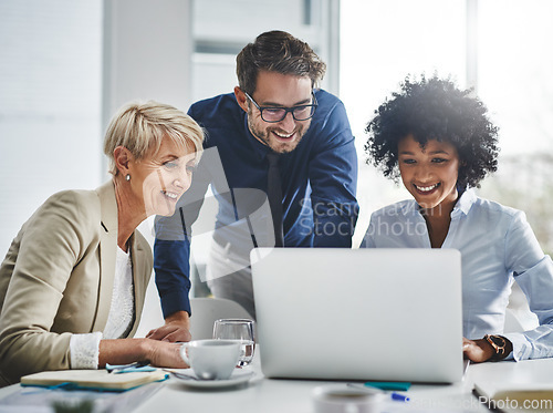 Image of Laptop, discussion and team in the office while working on a company project. Technology, teamwork and business people doing corporate research in collaboration together with technology in workplace