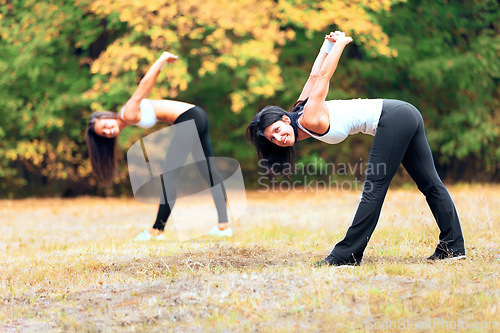 Image of Women, yoga stretching and portrait in a outdoor park for exercise and fitness. Health, wellness and arm warm up of female friends in nature on grass feeling happy with smile from body care and sport