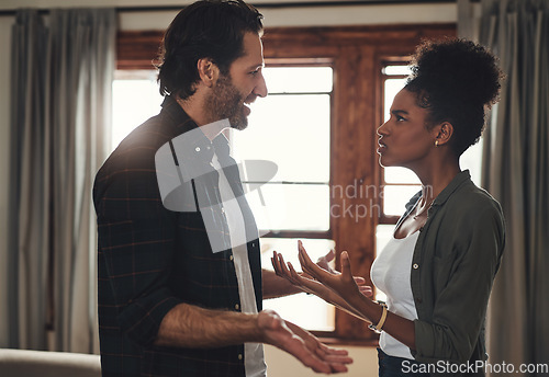 Image of Divorce, home and couple with a fight, conflict or cheating with disagreement, affair and argument. Partners, man or woman with relationship problems, discussion or frustrated with crisis and talking