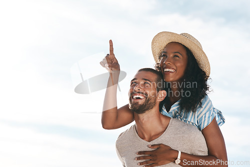 Image of Sky, piggyback and happy couple pointing at space with nature on romantic summer holiday travel and mockup. Love, man and woman on adventure with happiness on date, romance and vacation together.