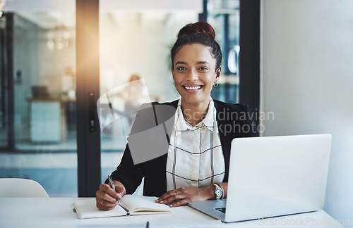 Image of Business woman, portrait and writing in a office with planning notes and corporate laptop. Female person, employee and work planner book with company paperwork and online for professional project