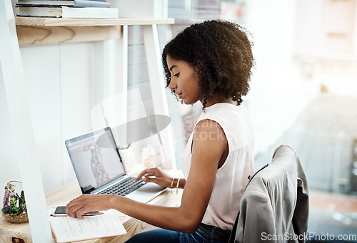 Image of Computer, phone and creative woman in office planning, productivity and brainstorming notes for business startup. Young African person with multimedia technology, laptop and notebook for design ideas