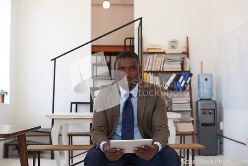 Image of Business, portrait and serious man on tablet in office for planning, connection and internet in startup agency. Focused black male worker, digital technology and app for research, insight and website