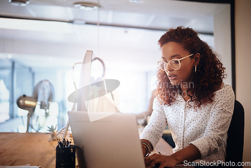 Image of Business woman, laptop and typing in workplace for strategy, planning schedule and thinking. Female content manager, seo expert or reading on web, app or social network communication with creativity