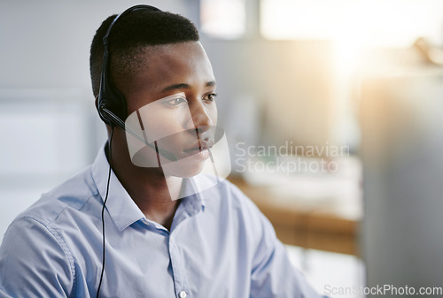 Image of Virtual assistant, consultant or black man in call center consulting online at customer services help desk. Contact us, email or serious African agent in telemarketing, CRM or telecom company office