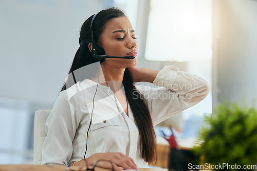 Image of Stress, customer service or woman in call center with neck pain injury while working in telecom help desk. Accident, injured agent or tired sales girl with joint pain emergency, fatigue and burnout