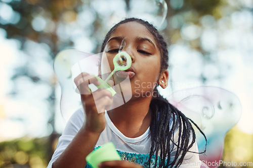 Image of Nature, princess costume and girl with bubble for playing fantasy, childhood games and happiness. Forest, fairy tale and face of African child in woods blowing bubbles for adventure, magic and fun