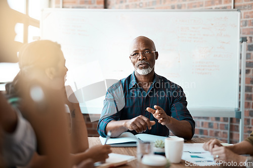Image of Business people, meeting and leadership of black man in office, talking or speaking. Teamwork, ceo and senior African male professional brainstorming, collaboration or planning strategy in workplace.