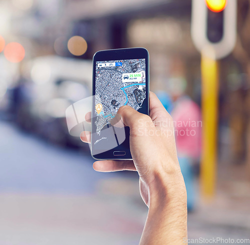 Image of Hand, maps and phone with gps in the city for travel, discovery or sightseeing direction. Technology, location and cellphone with online navigation app for trip or route in urban town street or road.