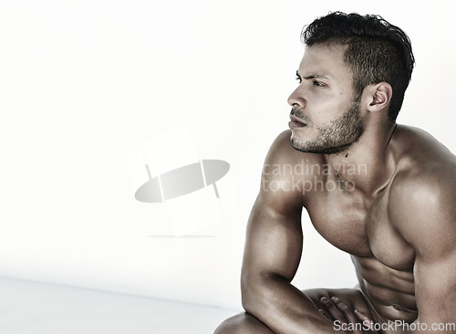Image of Mockup, thinking and handsome man for fitness training, exercise ideas and workout plan. Serious, muscle and a male athlete with focus, health idea and looking sexy at the gym for cardio with mock up