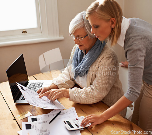 Image of Mother, senior woman and bills or laptop or calculator on table for budget and savings at home. Retirement, finances and elderly female person or doing taxes or pension in the house with pc or tech