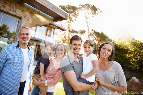 Image of Love, portrait of happy family at their home and outdoors together on lawn. Excited or happiness, care or bonding time for relationships and cheerful people in backyard of their house bonding