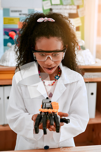 Image of Excited, education and girl with a robot, science class and innovation with progress, creativity and development. Female child, girl and student with technology, robotics and learning with excitement