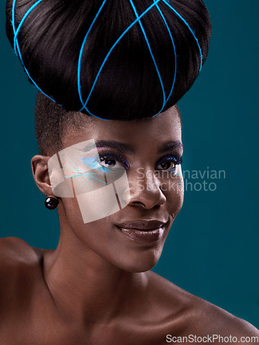 Image of Idea, hair care and cosmetics with a model black woman in studio on a blue background for beauty. Thinking, makeup and face with an attractive young female person at the salon for fashion or styling