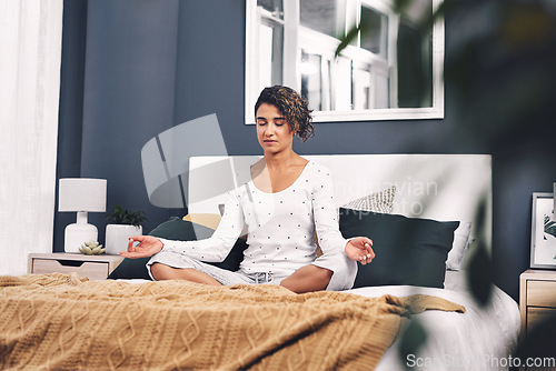 Image of Meditation, lotus and woman exercise in home bedroom for peace, mental health and calm chakra. Female person with hands to meditate for spiritual healing, zen and holistic yoga to relax on bed