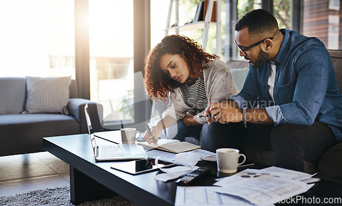 Image of Couple, budget with finance and bills, notes on payment for loan with mortgage and debt while at home. Financial review of spending, income and savings with man and woman writing in notebook