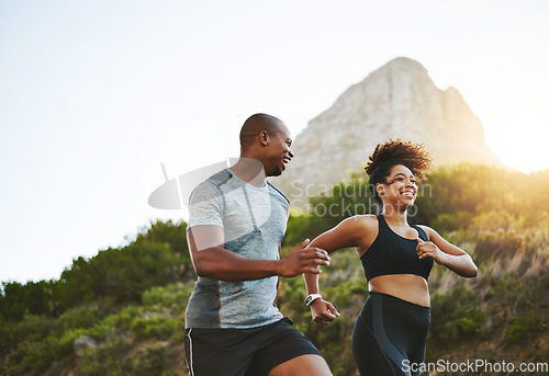Image of Sports, workout and couple walking by a mountain training for a race, marathon or competition. Fitness, nature and athletes doing an outdoor cardio exercise for health, energy and endurance at sunset