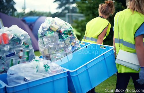 Image of Recycling, community service and volunteer work outdoor with cans and garbage at a park. Cleaning, sustainability and bottle recycle with people helping with rubbish and pollution for environment