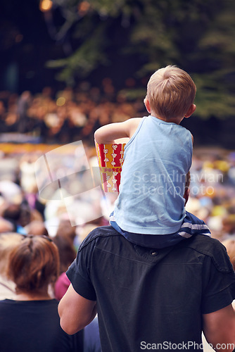 Image of Back, festival and a boy sitting on dad shoulders outdoor at a music concert together for bonding or entertainment. Family, kids and crowd with a father carrying his child son outside at an event