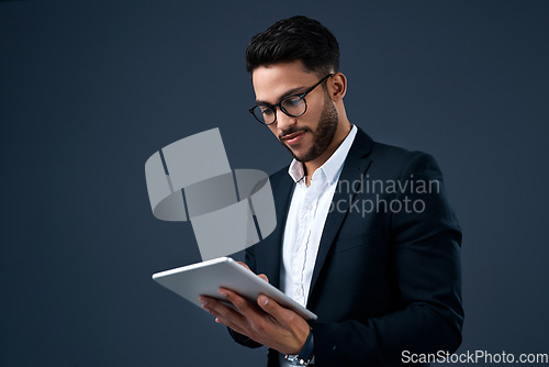 Image of Technology, professional young businessman with tablet and in a studio background. Social networking or digital communication, isolated and male person with mobile device search on backdrop.