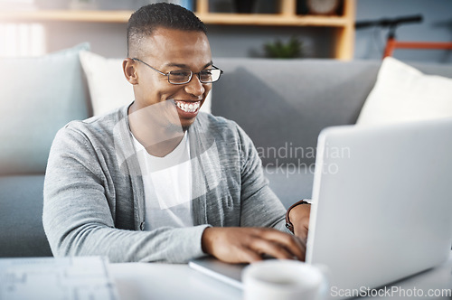 Image of Laptop, home and African man or student elearning, online course and college or university application or typing in living room. Happy african person on computer for education or scholarship research