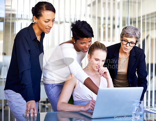 Image of Business, employees and women with a laptop, brainstorming and teamwork at the workplace. Female consultants, agents and workers share ideas, technology and startup with collaboration and innovation