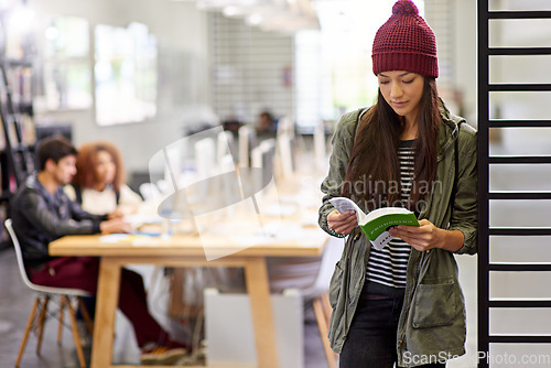 Image of Woman, student in library reading book and study for exam or research for project on university campus. Education, learning and academic development with female person holding textbook for knowledge