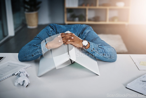 Image of Businessman, frustrated and laptop covering head in office and tired, depressed employee sleeping on desk. Man, work and stress or burnout, problem or technology fail, workload and headache