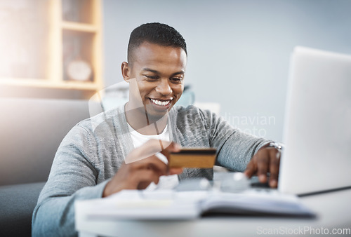 Image of Home, ecommerce and man with a credit card, laptop or happiness for payment. Male person, customer in the living room or happy client with a pc, technology or smile for online shopping and sale