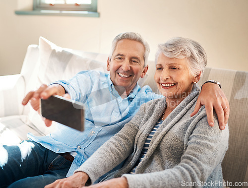 Image of Senior couple, selfie and happy on couch in retirement for social media, blog or post on internet. Elderly man, woman and photography for profile picture on app, web or smile together on lounge sofa