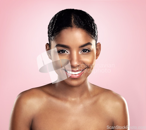 Image of Skincare portrait, happy woman and african face on pink background, studio and dermatology of natural beauty. Female model, aesthetic glow and smile for makeup cosmetics, facial treatment and shine