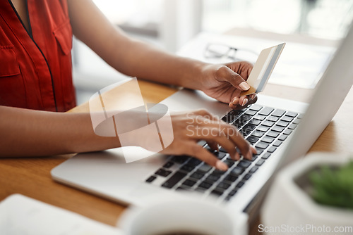 Image of Payment, credit card and woman at laptop for online shopping, e-commerce or internet store. Closeup of female entrepreneur at desk with keyboard for banking, booking or fintech website for business