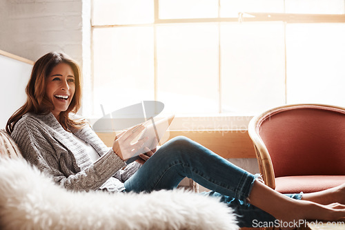 Image of Smile, tablet and credit card with a woman online shopping on a sofa in the living room of her home. Ecommerce, finance and fintech banking with a happy young female online customer in her house