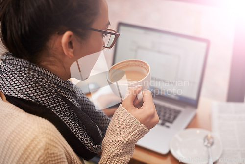 Image of Coffee, woman and laptop for remote work in cafe or coffee shop. Networking, female student or businesswoman with mobile device and newspaper in restaurant with hot beverage for copywriting.