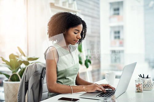 Image of Business, typing and black woman with a laptop, connection and search internet for website details, information and focus. Female person, entrepreneur and employee with a pc, technology and email