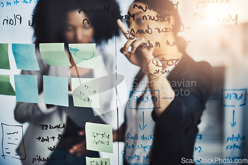 Image of Writing, brainstorming and meeting by business women planning schedule, calendar and sticky note in office. Agenda, management and female person team collaboration for solution, strategy and mission