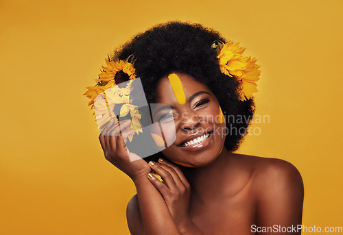 Image of Makeup, sunflower and portrait of black woman in studio for beauty, creative or spring. Natural, cosmetics and floral with face of model isolated on yellow background for art, self love or confidence