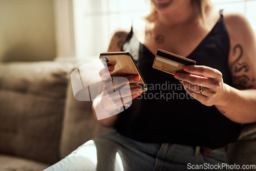 Image of Woman hands, phone and credit card on couch for online shopping, e commerce and fintech payment, loan or finance. Person on sofa typing banking information on mobile app for home and web transaction