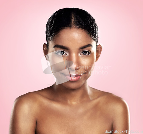 Image of Portrait of woman, skincare and face on pink background, studio and clean dermatology results. Happy african, female model and natural beauty with confidence, glowing skin and aesthetic cosmetics