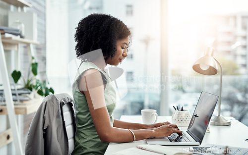 Image of Corporate, entrepreneur and black woman with a laptop, typing and connection for website launch. Female professional, consultant and employee with a pc, technology and search internet for information